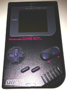 A black Game Boy with the logo of FIAT on it