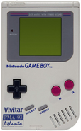 A Game Boy with a Vivitar PMA 93 Atlanta logo on it