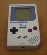 A Game Boy with a Milka Cow on it