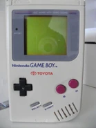 A Game Boy with a Toyota logo on it