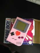 A Pink Game Boy with heart logo on it (Which was won in a gameshow)