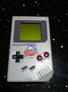 A Game Boy with a Planet Hollywood logo on it