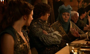 Sansa, her brother Loras, and their grandmother Olenna at Sansa's wedding feast.