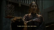 503 Red Priestess slave tattoo.jpg (164 KB) A red priestess points to her facial tattoo, explaining that she used to be a slave just like her audience