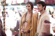 Ellaria Sand's costume at the royal wedding is considered a little too revealing and inappropriate in the rest of Westeros, but it is considered elegant formal wear in the warm climate of Dorne to the south.