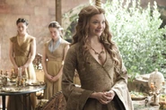 Now wed to Tommen, Margaery smugly flaunts her newfound royal position.