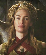 The heavily braided fan shaped hairstyle that Cersei wears on formal occasions in court; notice that handmaidens in King's Landing imitated this hairstyle along with her clothing fashions.