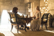 Daenerys meeting with Tyrion in episode 5.9 "Hardhome", wearing the same outfit she previously wore in episode 5.2: notice that it still has the intricate diamond-shaped embroidery meant to resemble dragon-scales, they are just a little more difficult to see on an all-white dress compared to her previous blue ones.