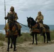 A patrol of Dornish soldiers that Jaime and Bronn run into, riding sand steeds. Turbans help protect against the hot desert sun in Dorne.