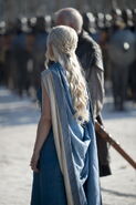 Daenerys in Season 4, rear view. Notice how she heavily braids her hair in Dothraki-style, because in Dothraki culture braids are worn as a symbol of victories and power.