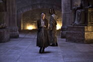 Arya with Jaqen H'ghar at the House of Black and White in "The Dance of Dragons"