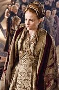 Sansa's wedding dress; its embroidery symbolically shows lions (for the Lannisters) overcoming wolves and fish (Starks and Tullys)