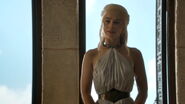 Daenerys in a private council during Season 4. Her more relaxed outfit in private is a more refined version of her earlier attempt to evoke the clothing style that the region's slaves wear: relatively simple and white, attaching to a metal collar resembling a slave-collar, though the collar itself is now more detailed.