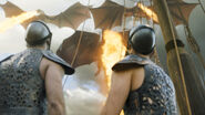 Daenerys's dragons setting a ship on fire