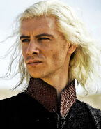 The old Targaryen-style features a tall collar with textured embroidery reminiscent of dragon scales.