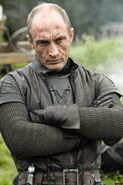 Roose Bolton wears more leather and less furs than the Starks, hinting at his family's flaying practices.