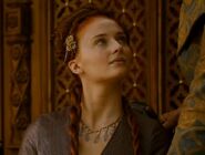 After Olenna inspects Sansa's necklace, notice that the stone at its far right side is now missing. Olenna surreptitiously drops the poison in Joffrey's wine cup as she walks away from the table.