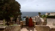 Illyrio, Viserys, and Daenerys look across the Narrow Sea toward Westeros.