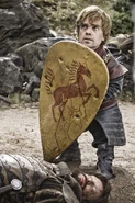Tyrion defends himself using the shield of a man-at-arms sworn to House Bracken in the Vale of Arryn. Promotional image from "The Wolf and the Lion."