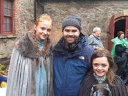 Sophie Turner and Maisie Williams with a crew member while filming the pilot in October 2009