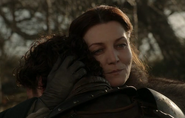Catelyn comforts her son, promising to avenge Eddard's death