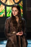 After her other dresses get torn up, by late Season 2 Sansa starts putting a little thought into how she dresses again; no longer imitating Cersei, instead moving back towards her mother Catelyn's look