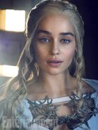 Magazine photo giving a closeup look at Daenerys's large metal neckpiece: the jewelry is shaped like a three-headed dragon, from the Targaryen heraldry.