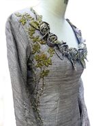 Closeup of the detailed embroidery on Sansa's hybrid dress she wears to the tournament.