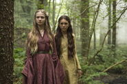 Young Cersei and Melara Hetherspoon, 25 years ago, in a flashback scene from the Season 5 premiere. Notably, Melara does not dress like Cersei despite being from a Lannister vassal House - implying that Cersei recently adopted this new, Targaryen-like style, which gradually replaced the older Westerlands-style Melara was wearing.