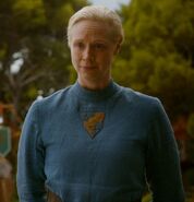 Brienne of Tarth at the royal wedding, wearing an outfit with an embroidery of the House Tarth sigil on the front.