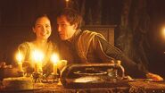 Edmure flirts with Roslin at their wedding feast.
