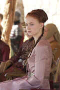 Sansa at Joffrey's name day tourney in "The North Remembers".