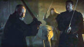 Ghost prepares to defend Jon's body alongside Davos and some of the Black Brothers against Alliser Thorne.