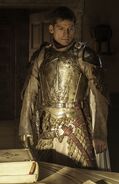 Jaime in Season 4 Kingsguard armor: notice how the design of the crown symbol on his chest has changed to incorporate three swords into the crown design.