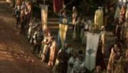 The banner of House Lefford (centre, blue and yellow) at the Tourney of the Hand in "Cripples, Bastards and Broken Things".