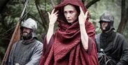 Melisandre's bright red riding cloak