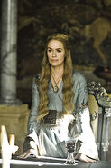Cersei's costumes in early Season 1 are blue or gold, in a mild effort to still appear friendly.