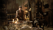 Gendry working in Tobho Mott's blacksmith forge.