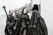 Yara Greyjoy flanked by Greyjoy warriors ("Mhysa").