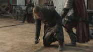 Ned is stabbed in the back of his leg by a Lannister guardsman