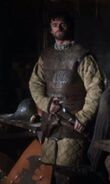 Ser Willis at the Inn at the Crossroads. His shield bearing the sigil of House Whent is by his feet.