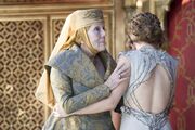 Olenna comforts Margaery as Joffrey chokes to death.