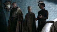 Lord Royce talks with Lord Baelish and Lady Waynwood.