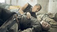 Grey Worm holds a dead Barristan Selmy in "Sons of the Harpy (episode)".