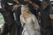 In Season 5, Daenerys drastically shifted to a new costume scheme, changing from her signature Dothraki blues to white or dove-grey gowns. This is meant to show how idealistically pure and above it all she feels, indicating a break from the reality on the ground in Meereen - she actually cannot simply command the former slaves and slave-masters to stop fighting each other, and her control over Meereen has become tenuous.