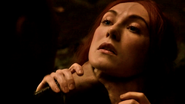 Stannis choking Melisandre in "Valar Morghulis."