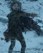 Leaf saving Bran Stark from wights at the entrance to the Cave of the three-eyed raven. Note the pattern of white spots or stripes on her legs in this image.