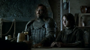 Sandor and Arya at an inn, speaking with Polliver