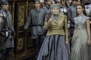 Olenna in Season 6, with Tyrell handmaidens and infantry. The Tyrells are from the north of the Reach. Short peaked shoulder cuffs, dresses lace up the front, and plunging necklines.