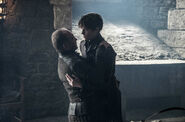 Roose is killed by Ramsay in the same manner he killed Robb.